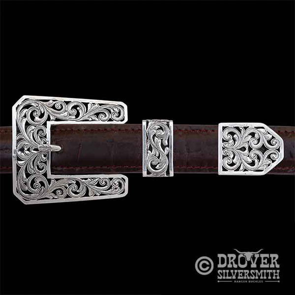 The Cattleman Sterling Silver Belt Buckle features an astonishing filigree style with free space between silver scrolls in the buckle, tool and tip. Upgrade for larger size available!